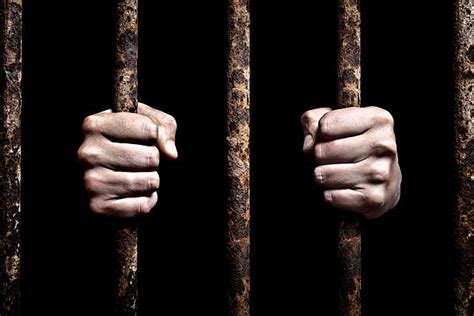 Hands On Prison Bars Stock Photos Pictures And Royalty Free Images Istock