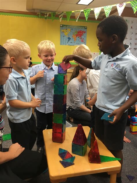 Children Working Together To Build A Tower