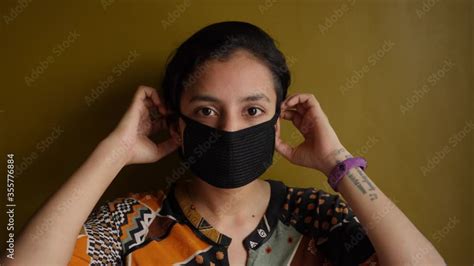 A Beautiful South Asian Indian Girl Wearing Mask In The Indoor Setting