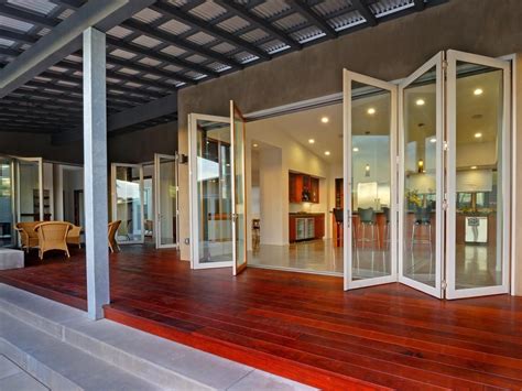 open your interiors to the great outdoors by incorporating glass walls sliding glass doors or