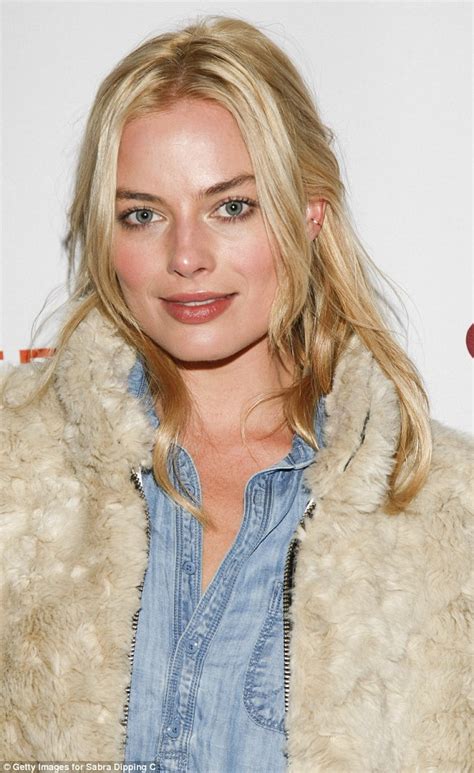 A Vision In White Margot Robbie Dons Fur Coat With Skinny Jeans And