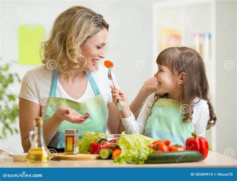 Kid Girl And Mother Eating Healthy Food Vegetables Stock Image Image