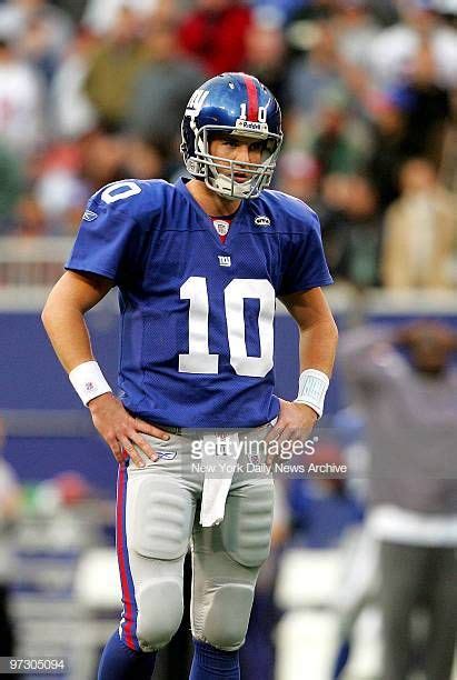 New York Giants Quarterback Eli Manning Stands On The Field After