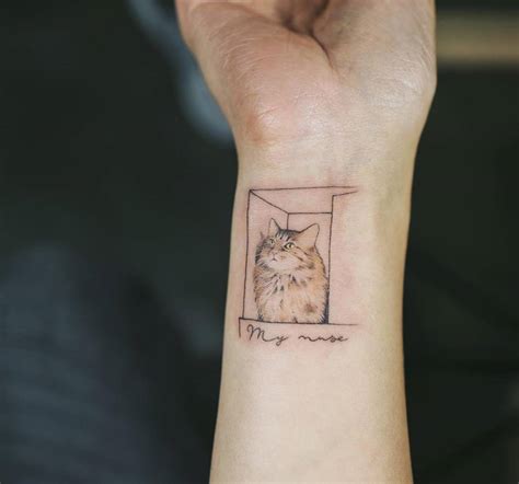 Small Cat Inside A Box Tattoo On The Right Inner Wrist