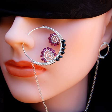 The prodigy musician keith flint has several face piercings, including his nose, septum, ears, and tongue. Women Beauty Tips: 10+ Unique Nose Piercing Jewelry