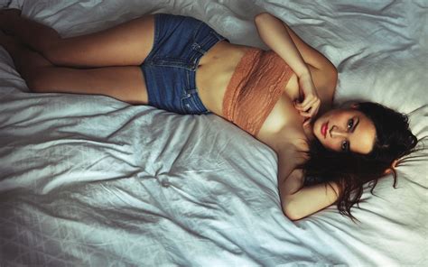 Free Download HD Wallpaper Brunettes Women Beds Models Lying Down Denim Shorts X