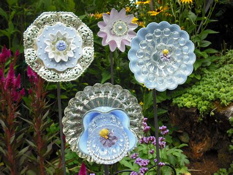 How to make the mounts for these recycled glass flowers is a detail that most of the pinterest pins one of mom's presents this year was a set of garden flowers made from odd plates and dishes. Using Recycled Glass To Make Flowers - DIY Glass Flowers ...