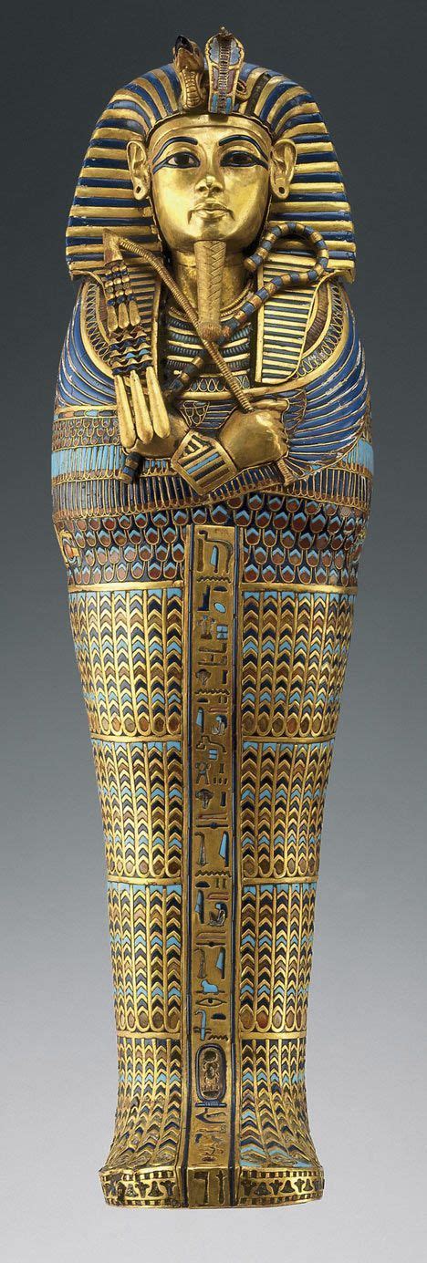 An Egyptian Gold And Blue Vase With The Image Of Pharaoh Tutane On It