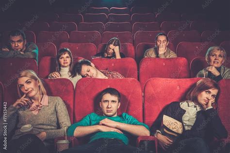 Group Of People Watching Boring Movie In Cinema Stock Photo Adobe Stock