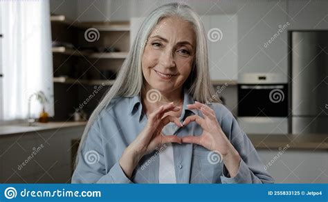 kindly thankful 60s woman elderly mature volunteer female pensioner gray haired granny