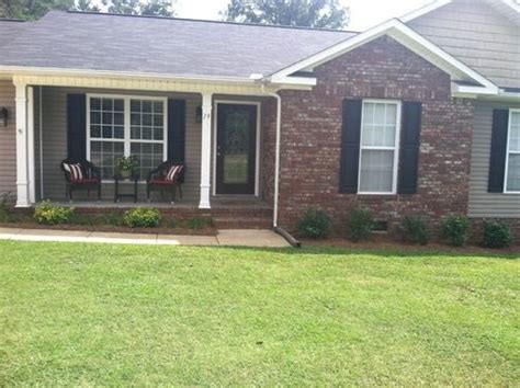 It could be painted if needed.? Red brick and gray siding, ranch house. White trim, black ...