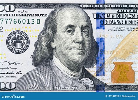 Close Up Overhead View Of Benjamin Franklin Face On 100 Us Dollar Bill