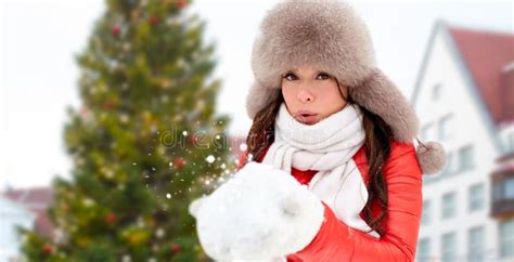 Woman Blowing To Snow Over Christmas Tree Stock Photo Image Of