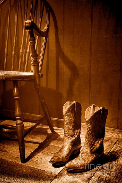 The Cowgirl Boots And The Old Chair Sepia Photograph By Olivier Le