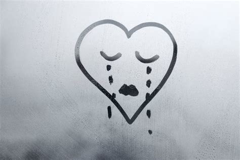 Drawn Sad Face In Shape Of Heart With Closed Eyes And Tears On Foggy