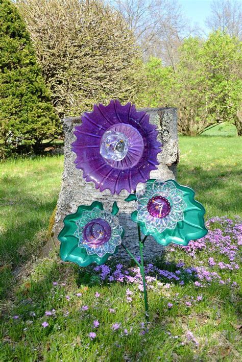 The kodama and their stakes are all one piece of solid glass so you don't have to worry about the piece. Glass Plate Flower Garden Art. All drilled glass with ...