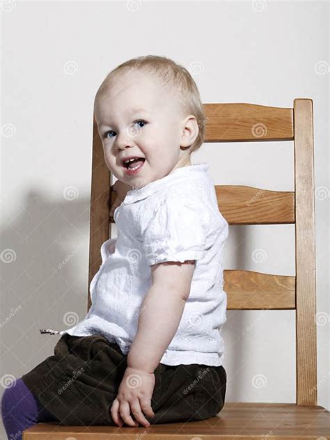 Proud Happy Baby Girl Sitting On Chair Stock Photo Image Of