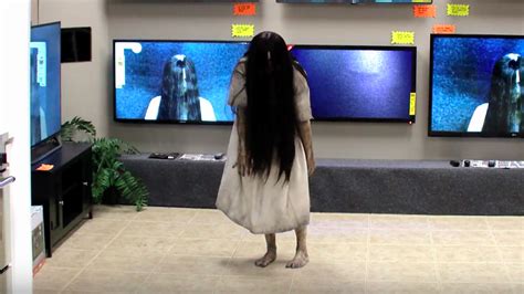 samara actually comes out of a tv and scares the hell out of these customers in a rings prank