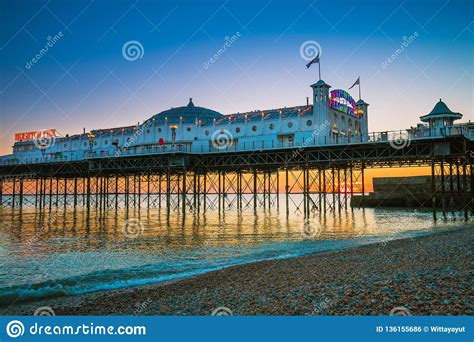Brighton Pier Beach With Sunset Golden Hour At Sussex England Uk