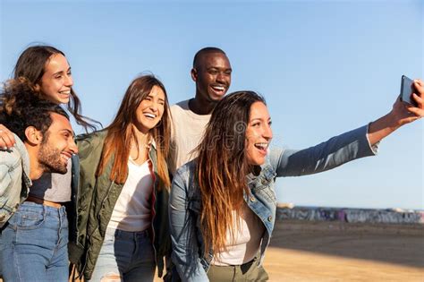 Group Of Happy Multiracial Friends Taking Selfie Together Using Mobile