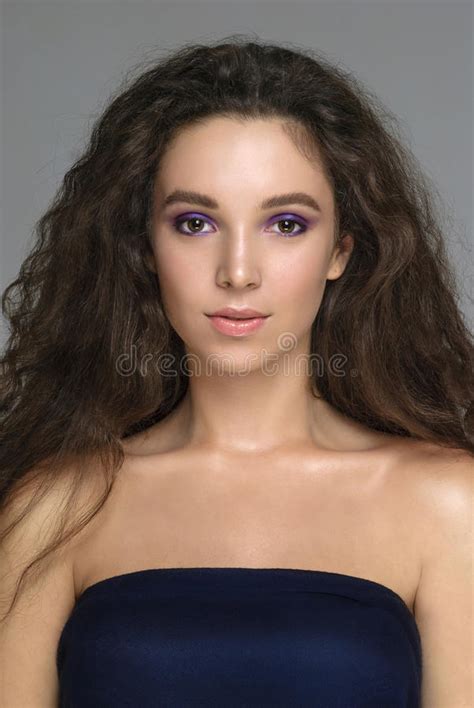 Portrait Of Beautiful Young Woman With Creative Makeup With Curl Stock