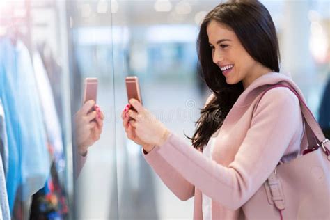 Woman Using Mobile Phone In Shopping Mall Stock Image Image Of
