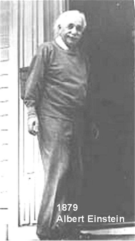 An Old Black And White Photo Of A Man Standing In Front Of A Door With