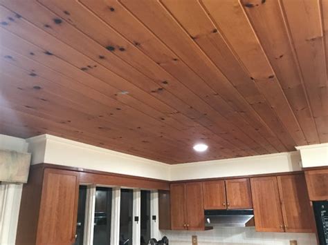 Installing pine paneling on a tall ceiling will instantly make the room feel cozier and warmer. Paint Pine wood ceiling white or remove or leave it?