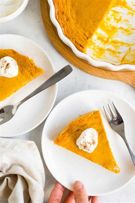 Two Plates With Slices Of Pumpkin Pie On Them