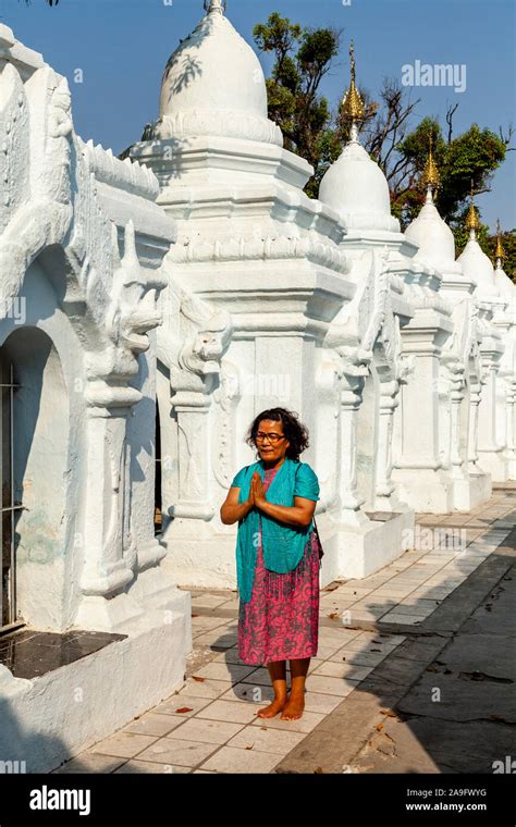 A Burmese Woman Praying At The Kuthodaw Pagoda Mandalay Myanmar Stock