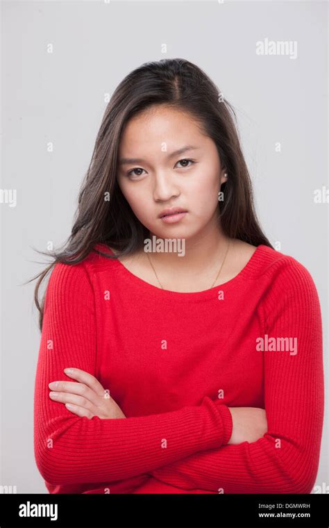 Portrait Of Teenage Girl 16 17 With Arms Crossed Stock Photo Alamy