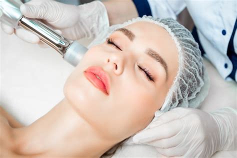 Premium Photo The Doctor Cosmetologist Makes The Rejuvenating Facial Injections Procedure For