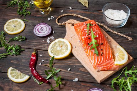 Fold the foil over the salmon and vegetables, cover completely and seal shut. Delicious Portion Of Fresh Salmon Fillet With Aromatic ...