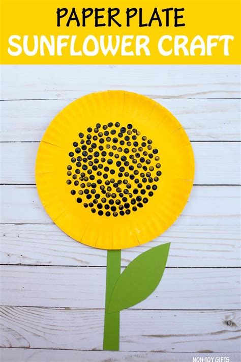 A Paper Plate Sunflower Craft On A White Wooden Table With Text Overlay