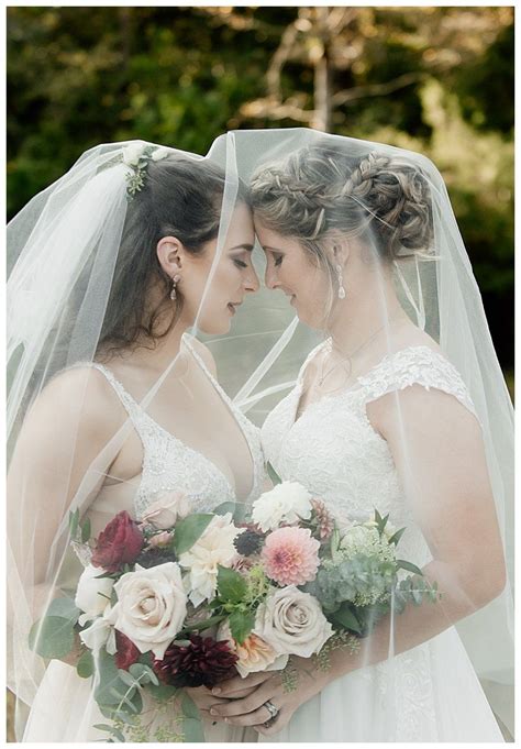 Romantic Lesbian Wedding Photo Of Brides Under Veil North Carolina Wedding Filled With