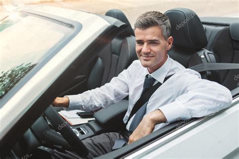 Successful Businessman Driving His Car — Stock Photo © Stockasso 124984802