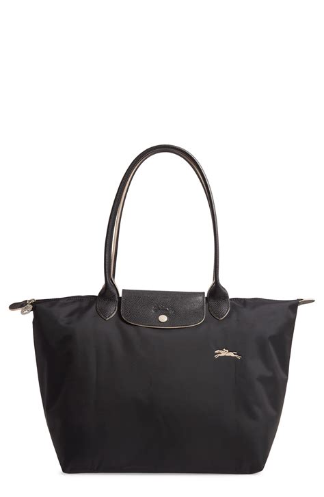 This folding shoulder bag personalise this item. Longchamp Le Pliage Club Tote in Black - Lyst