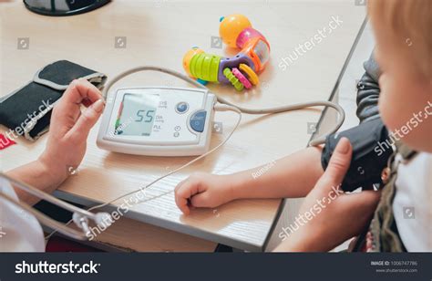 Doctor Measuring Blood Pressure Child Medical Stock Photo 1006747786