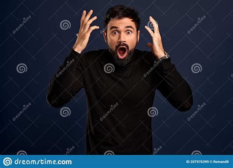 Horizontal Shot Of Stupefied Stunned Shocked Bearded Young Male Keeps Mouth Widely Opened Being