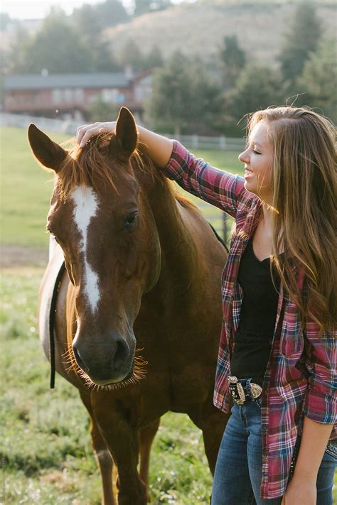 Teenage Girl Petting Her Horse By Stocksy Contributor Tana Teel