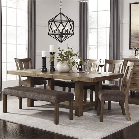A rubberwood and oak veneer distressed espresso top sits upon an antique white finish wood base. Tamilo 7 Piece Table & Chair Set with Bench by Signature ...