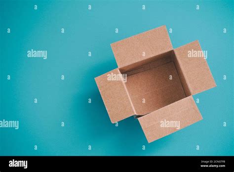 Open Cardboard Box On A Blue Background Stock Photo Alamy
