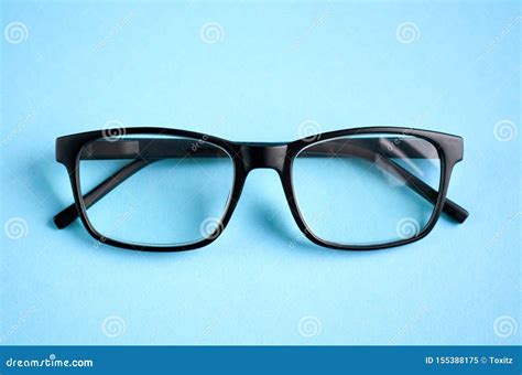 black glasses on blue background composition eyeglasses stock image image of concept layout