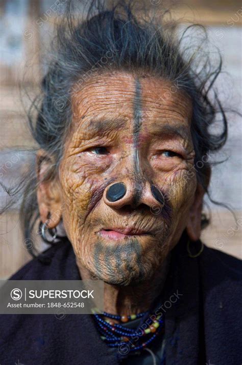 Old Woman From The Apatani Tribe Known For The Pieces Of Wood In Their Nose To Make Them Ugly