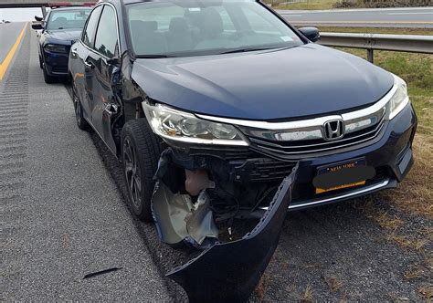 Sideswiped and pushed off the road by a pickup truck hauling a flatbed