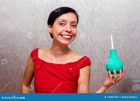 Smiling Woman Holding An Enema Stock Image Image Of Pear Clyster