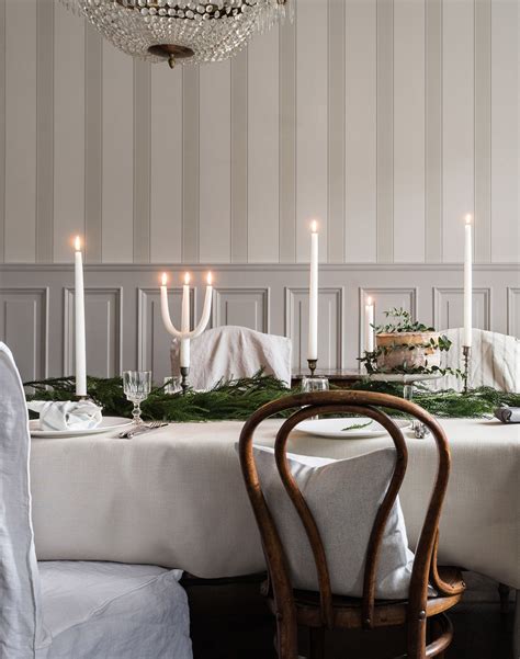 Elegant Scandinavian Dining Room With A Chandelier Tablecloth And