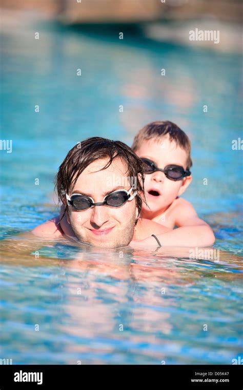 Father And Son In Swimming Pool Stock Photo Alamy