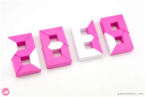 The Letters B C E And D Are Made Out Of Pink Origami