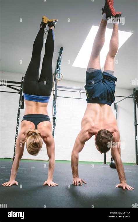 Couple In Gym Training Handstands Stock Photo Alamy